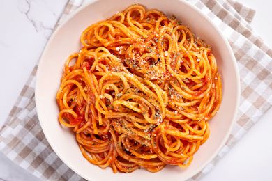 A dish of spaghetti in red sauce