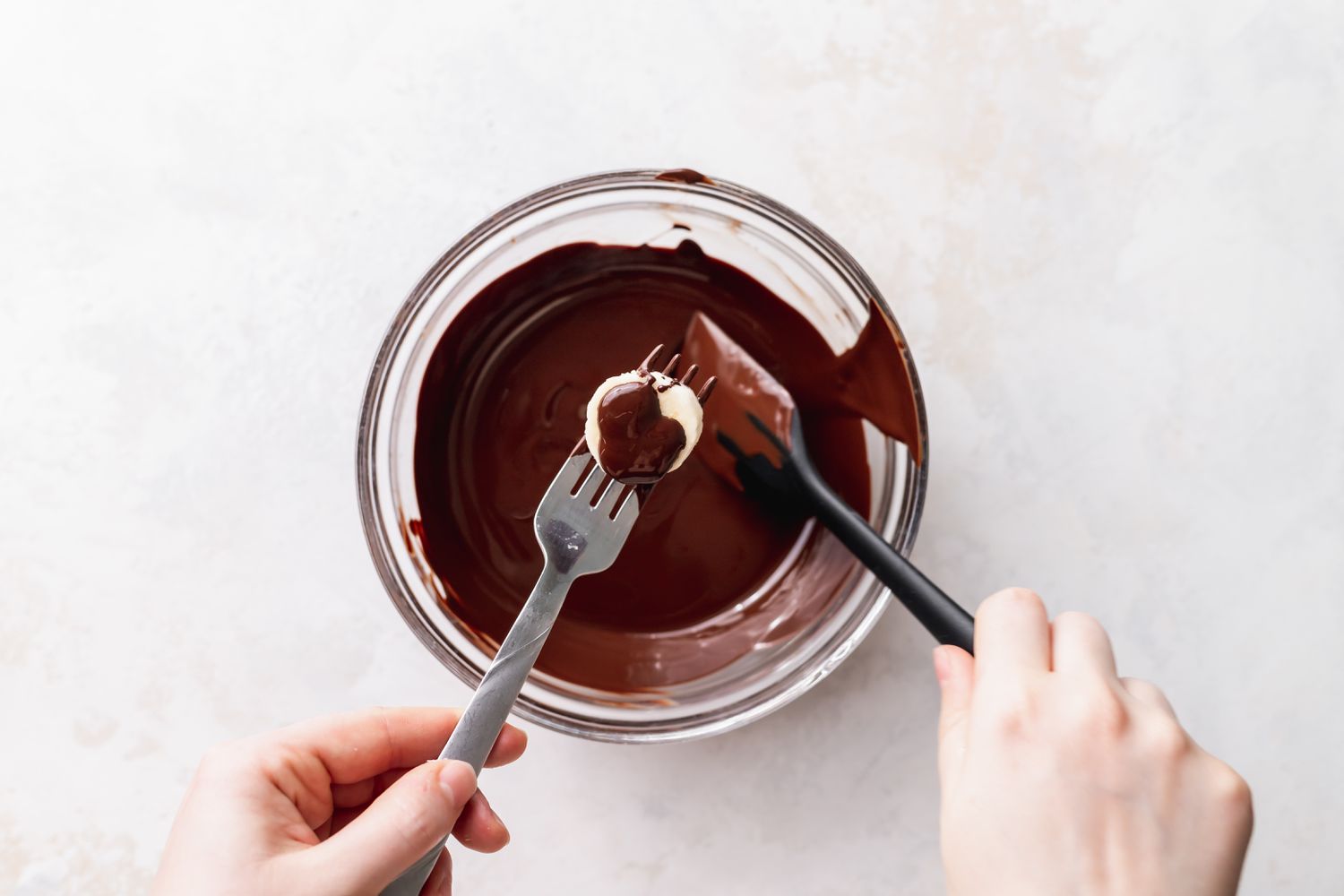 Spatula Used to Cover Bananas in Chocolate