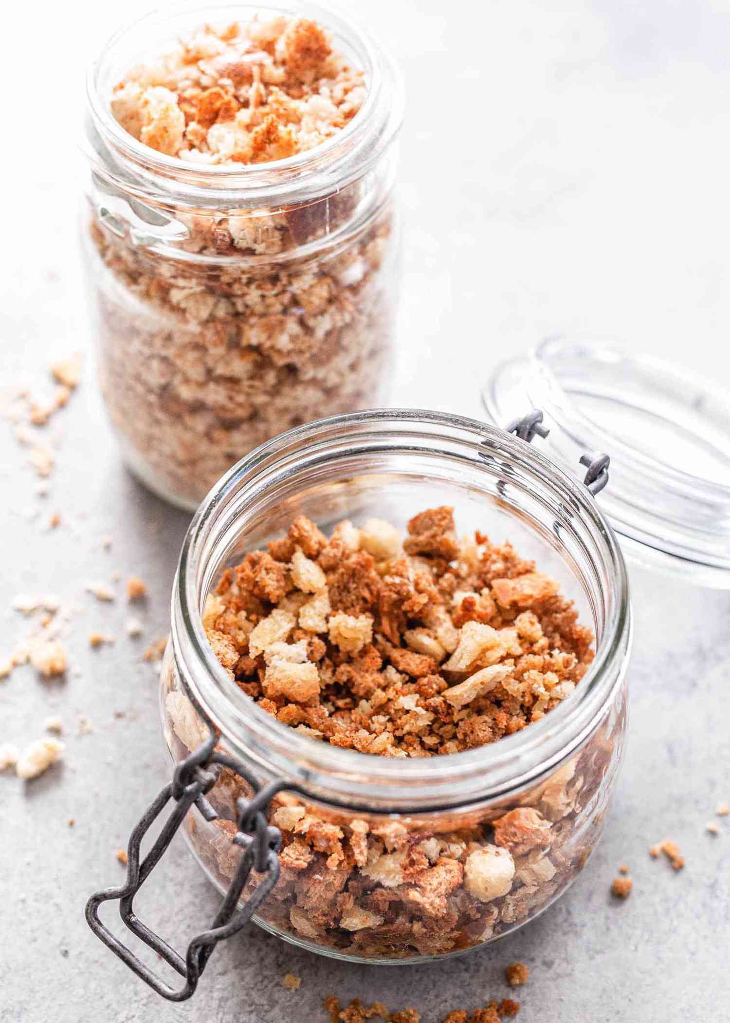 How to Toast Breadcrumbs in the Oven -- two jars filled with toasted breadcrumbs