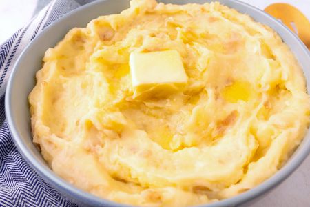 3-Ingredient Garlic Mashed Potatoes in a bowl topped with a pat of butter