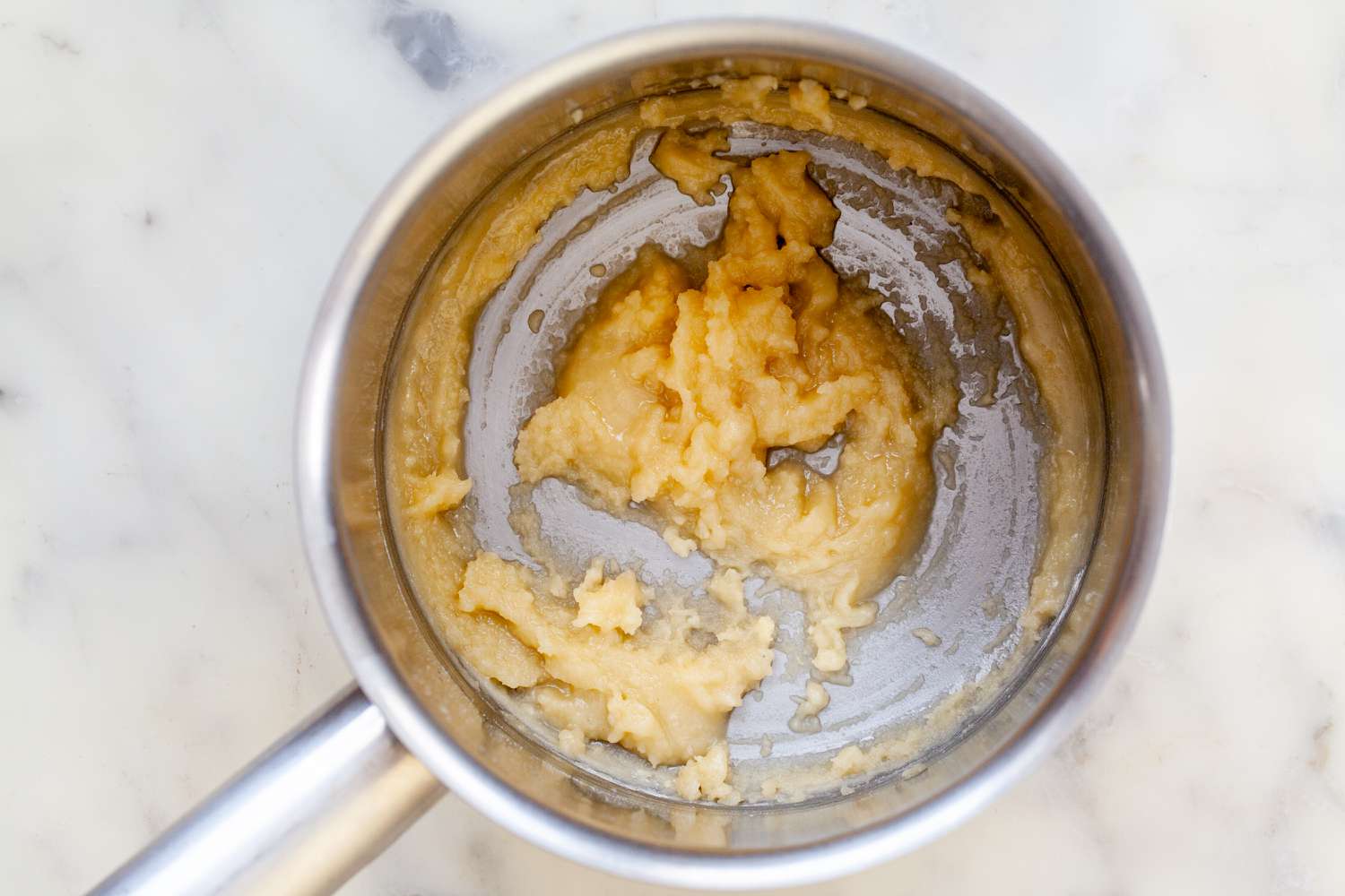 Making white sauce or béchamel sauce and starting with a roux.