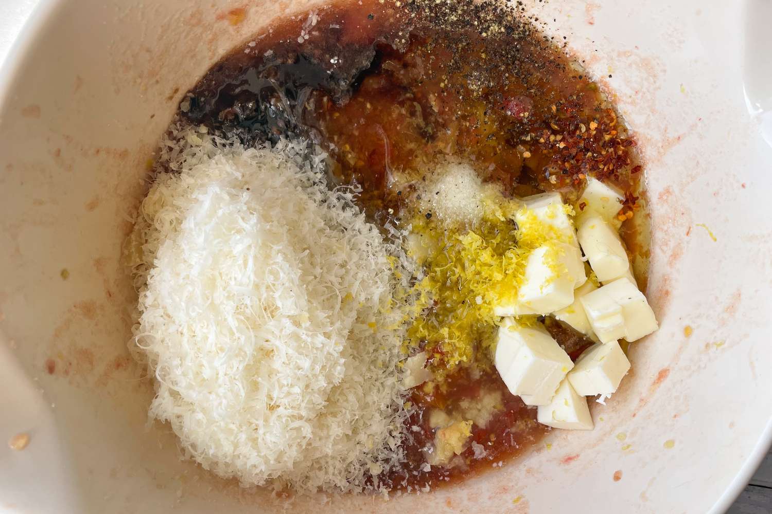 Parmesan, Butter, Lemon Zest, and Smashed Tomato for No Cook Tomato Sauce Pasta