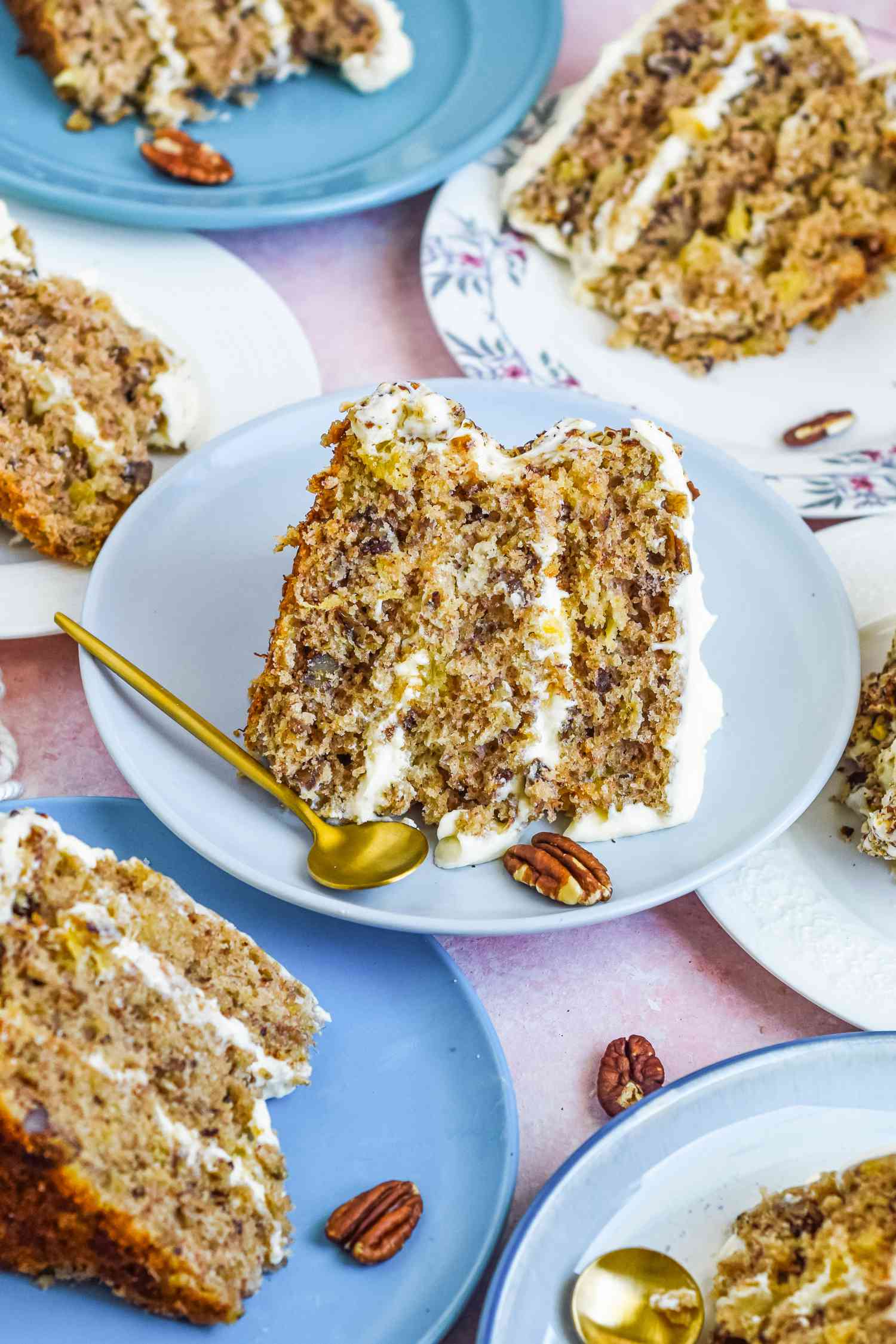 Overhead view of a table set with multiple plates of southern hummingbird cake.