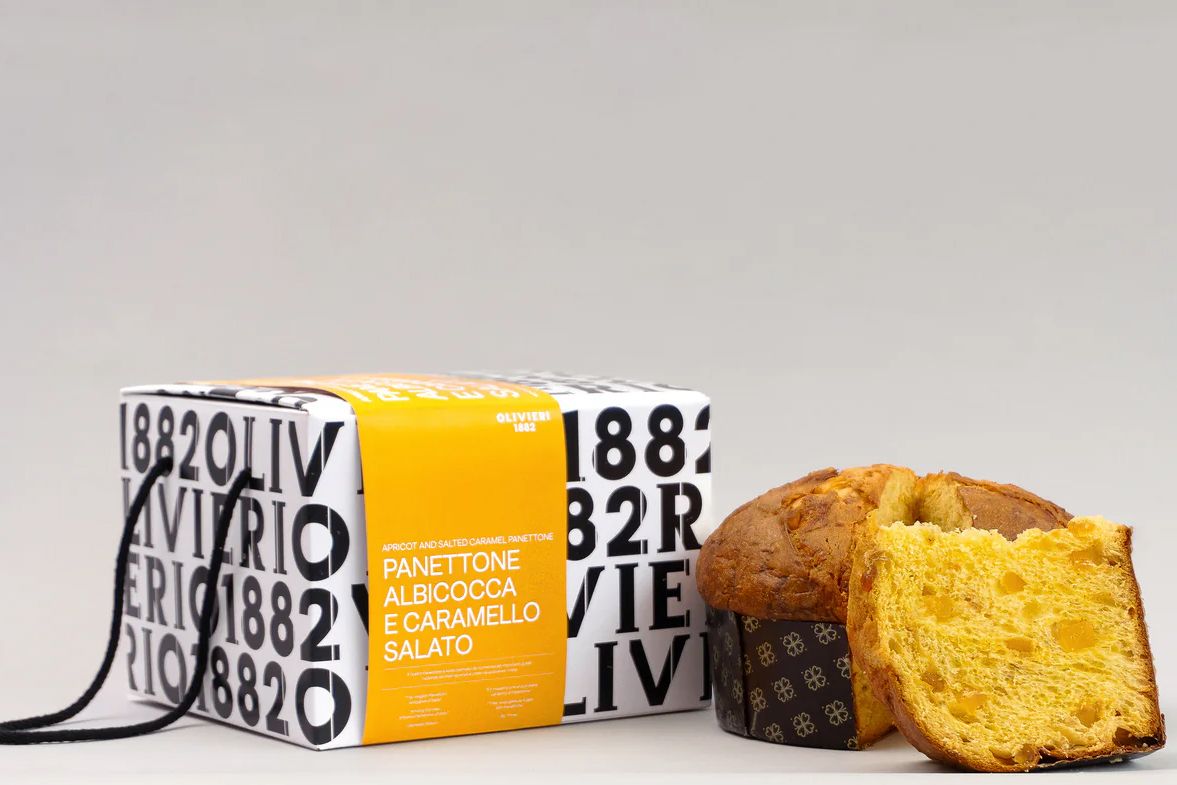 A packaged and sliced panettone dessert with visible branding and text