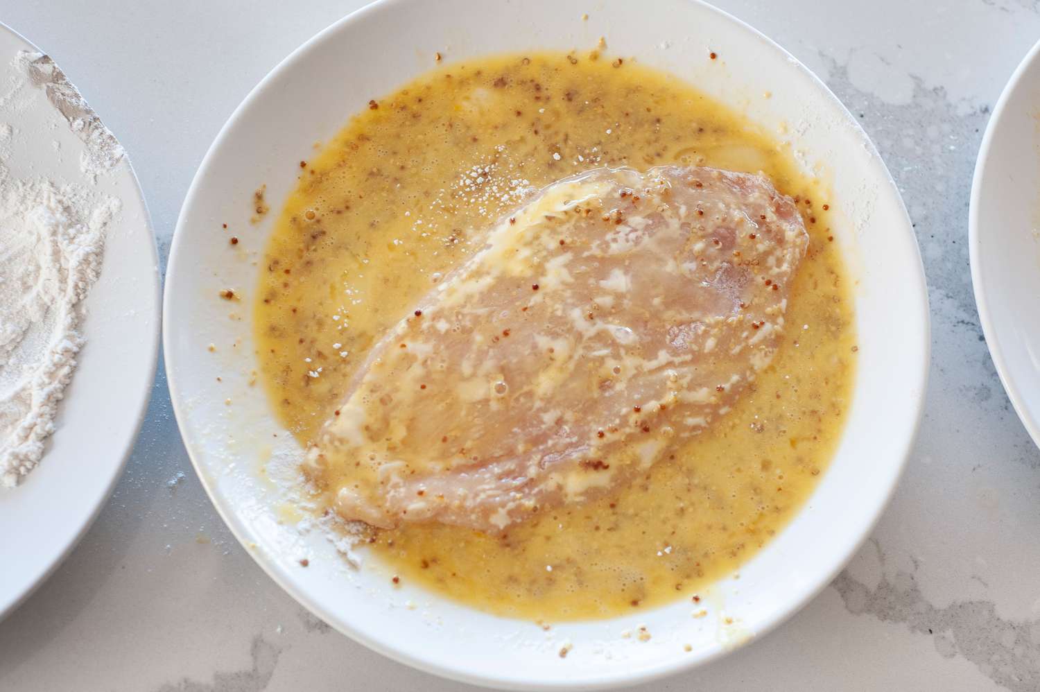 dip chicken cutlets in egg mixture