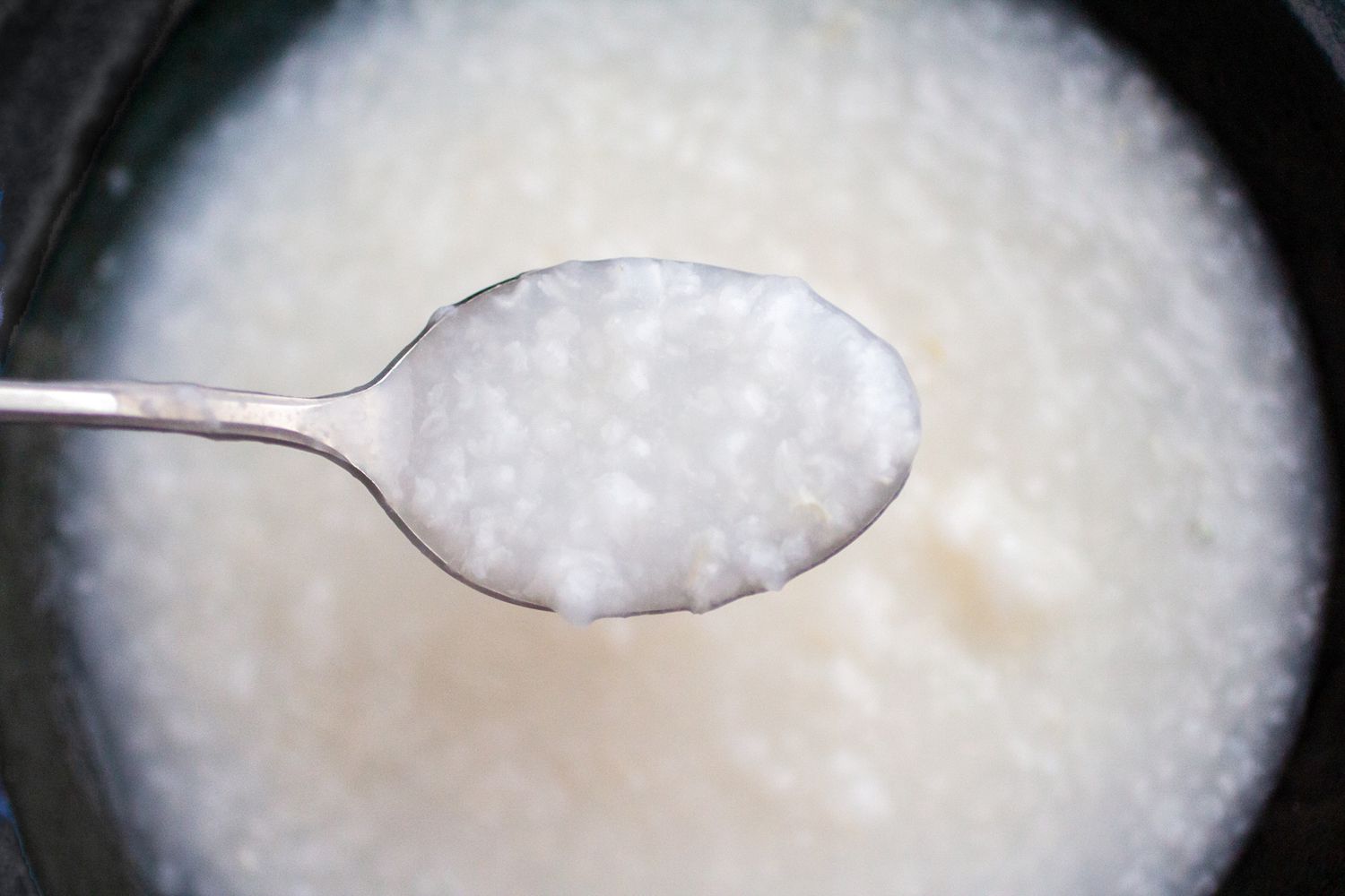 Jook in a spoon with more in the bowl below it