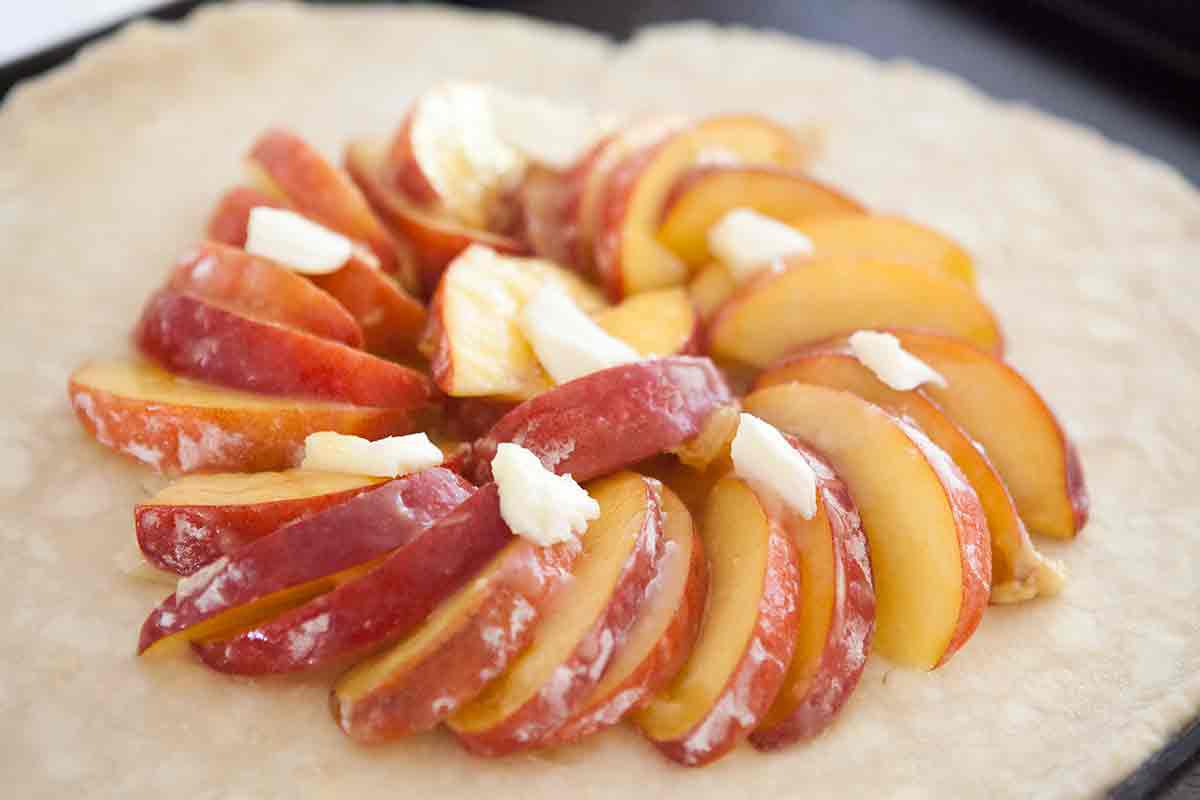 arrange peaches and dot with butter for the galette