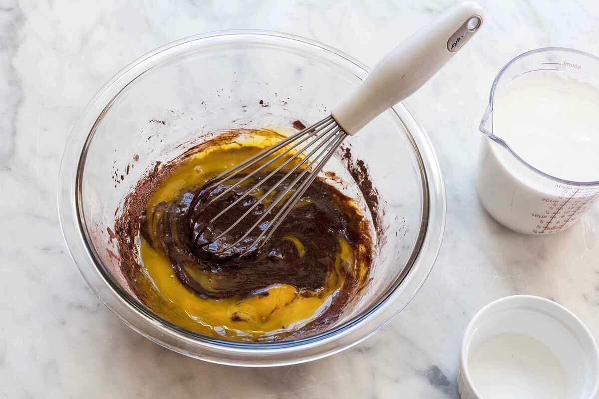 Chocolate pie filling whisked with in a bowl.