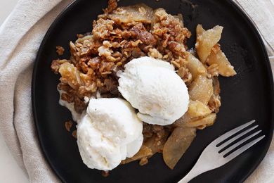 Apple crisp recipe topped with vanilla ice cream.