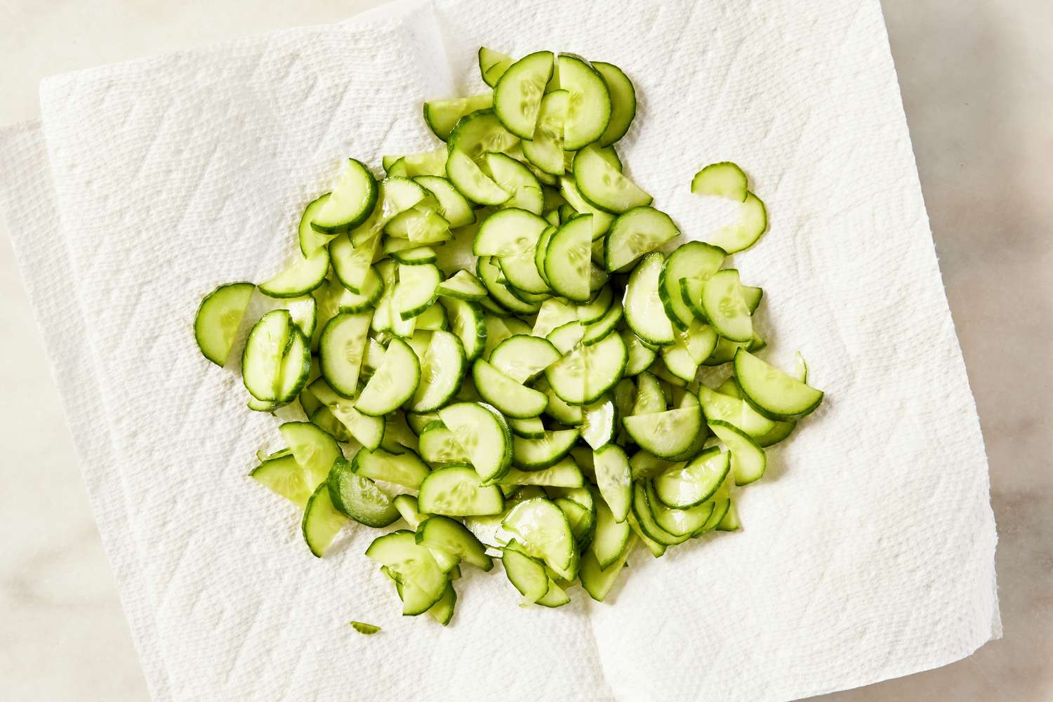 salted cucumbers drying on a paper towel for Korean-style potato salad recipe