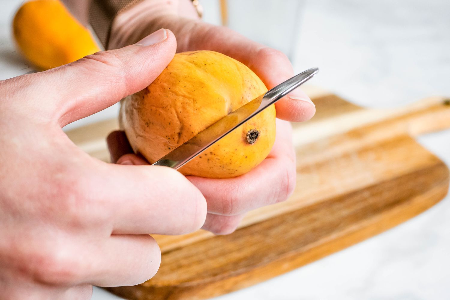 peel mango with a dull knife