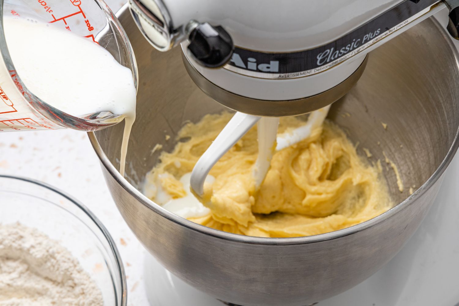 Alternating, Buttermilk and Flour Added to Creamed Mixture in a Stand Mixer for Muffin Tops Recipe