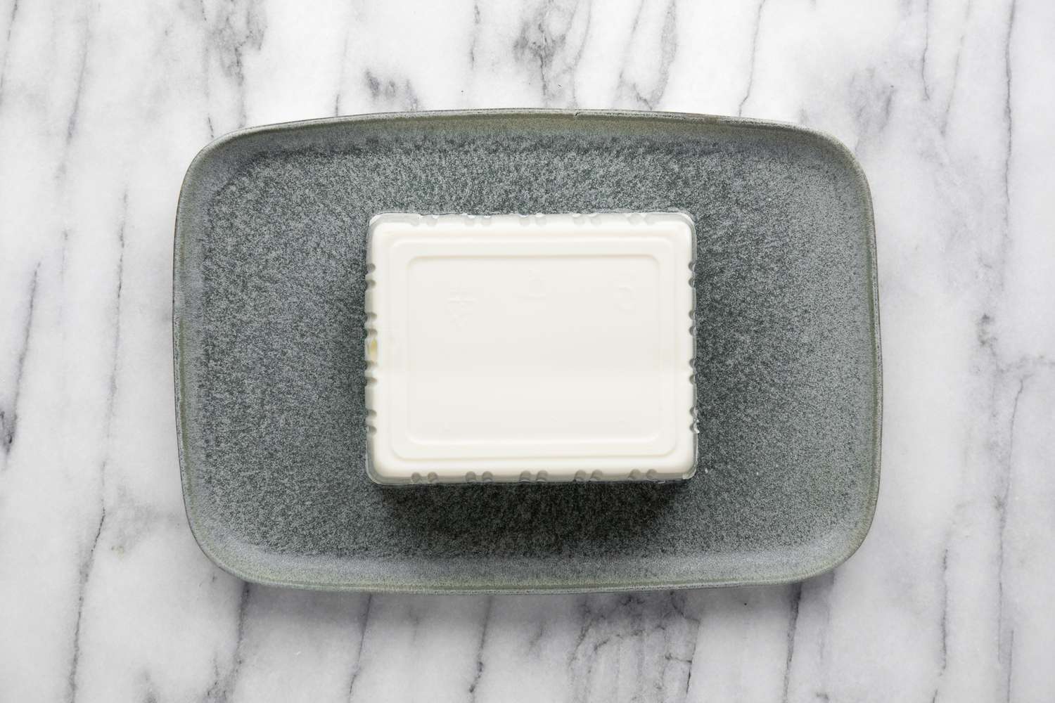 Block of Silken Tofu on a Platter for Silken Tofu with Sesame Soy Sauce Recipe