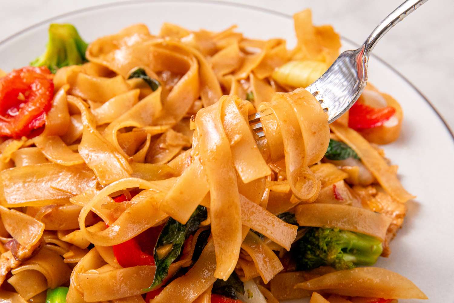 close up view of Easy Drunken Noodles, some noodles on fork