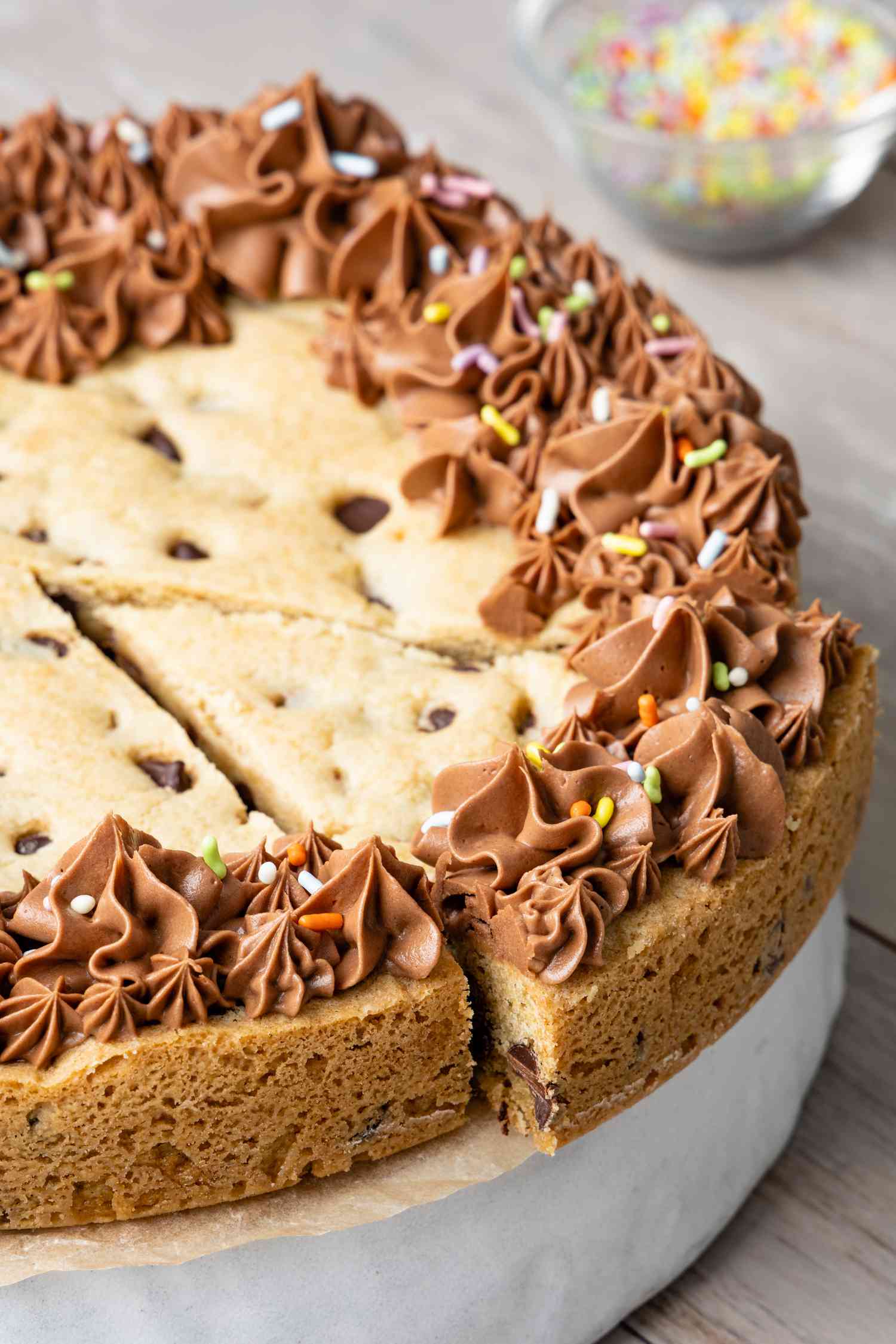 Chocolate Chip Cookie Cake with a Slice Cut