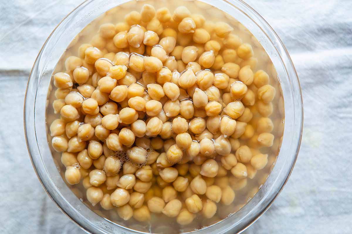 Indian Chana Masala Recipe - chickpeas soaking in a bowl of water