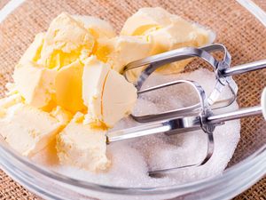 Butter and sugar in a bowl with a mixer