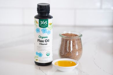 Flax oil bottle with glass jar of flaxseeds