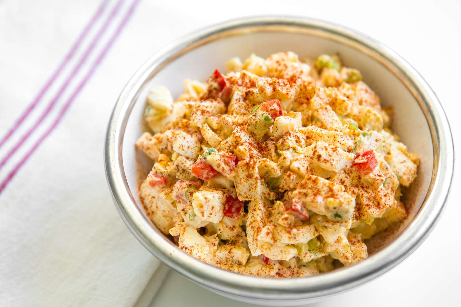Bowl of Deviled Egg Salad Topped With Paprika