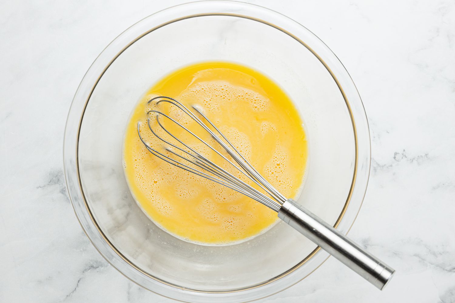 Bowl of Eggs with a Whisk for Turkish Scrambled Eggs Recipe