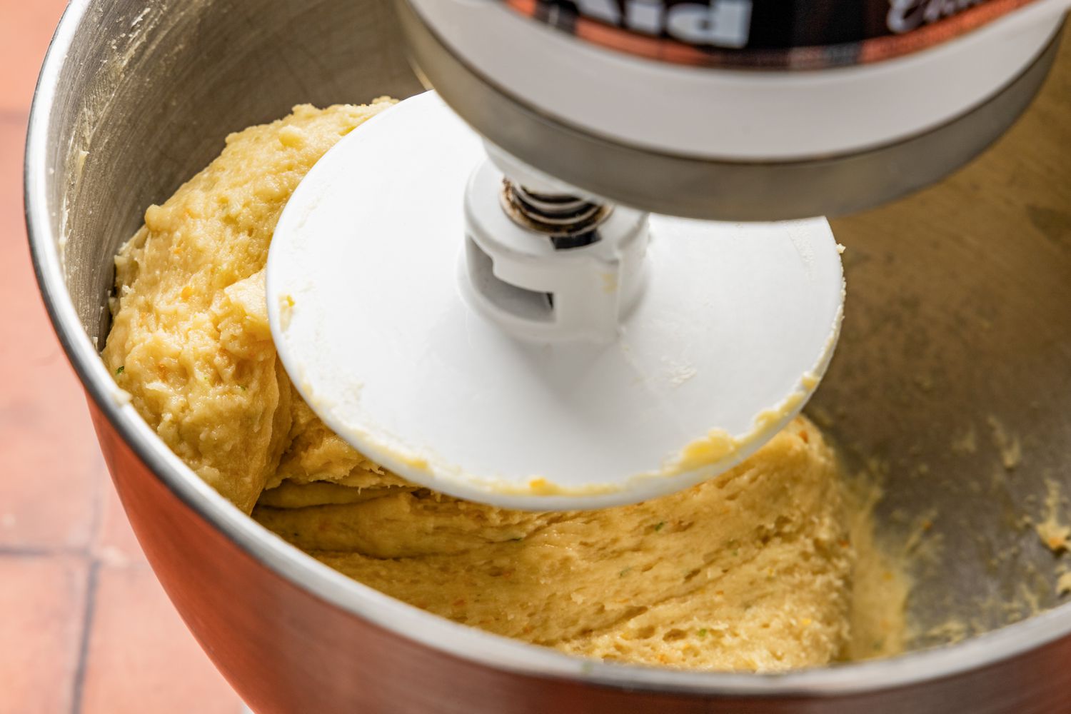 Stand mixer mixing the pan de muerto ingredients using a dough hook 