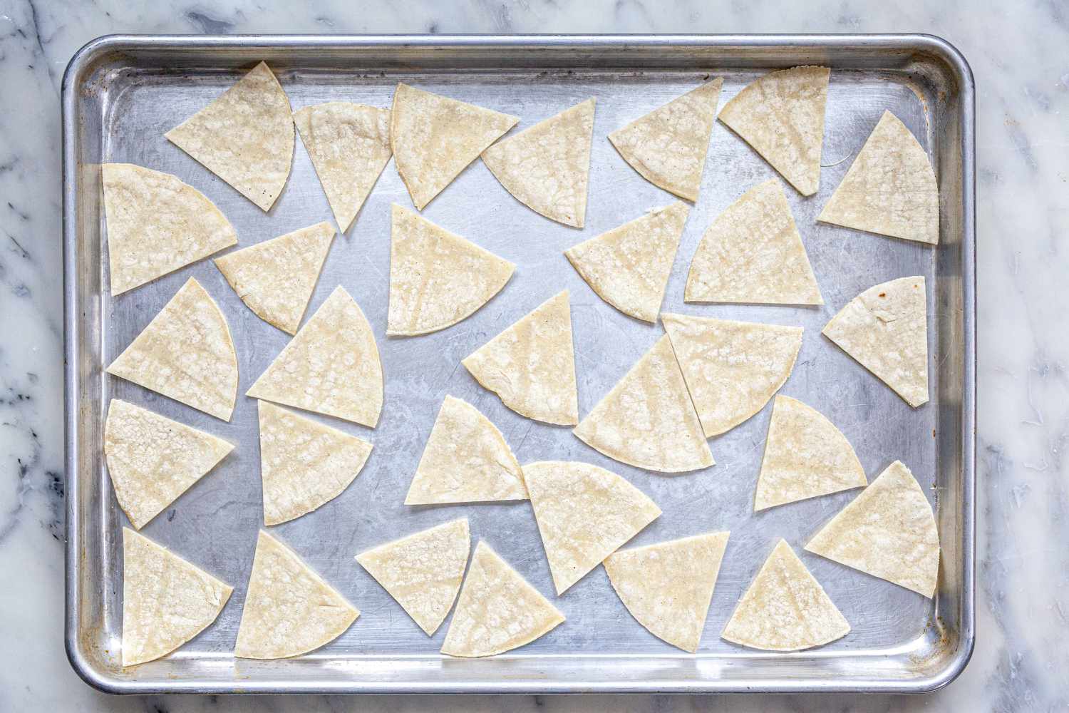 Tortilla wedges on a sheet pan