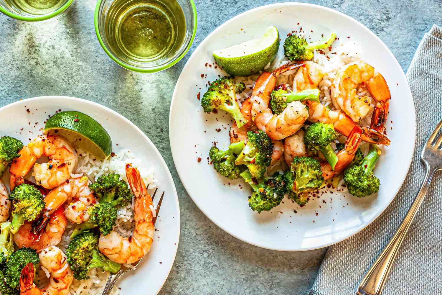 Sheet Pan Hot Honey Roasted Shrimp and Broccoli on two white plates.