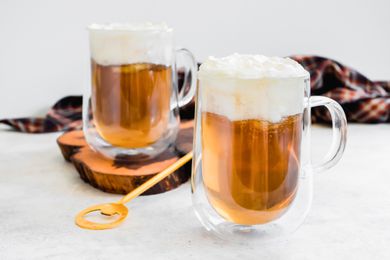 Mugs of Butterbeer Topped with Whipped Cream