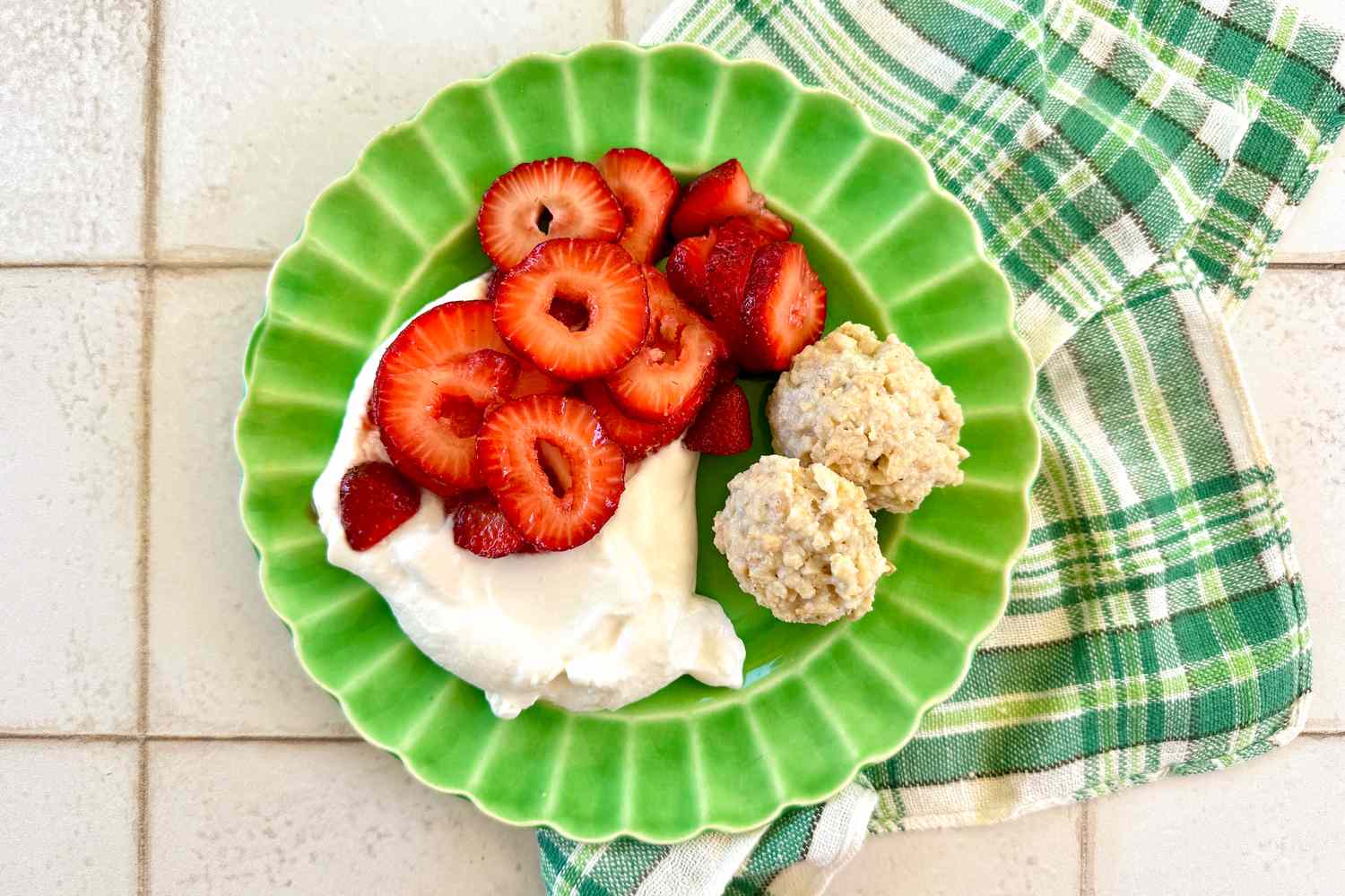 martha stewart's rustic almond macarons on a plate with strawberry slices, and whipped cream