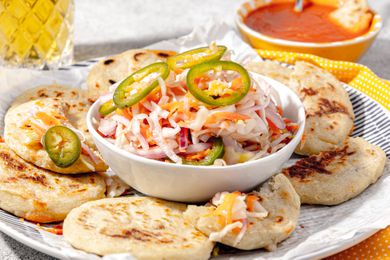 Curtido Served in a Bowl with Pupusas