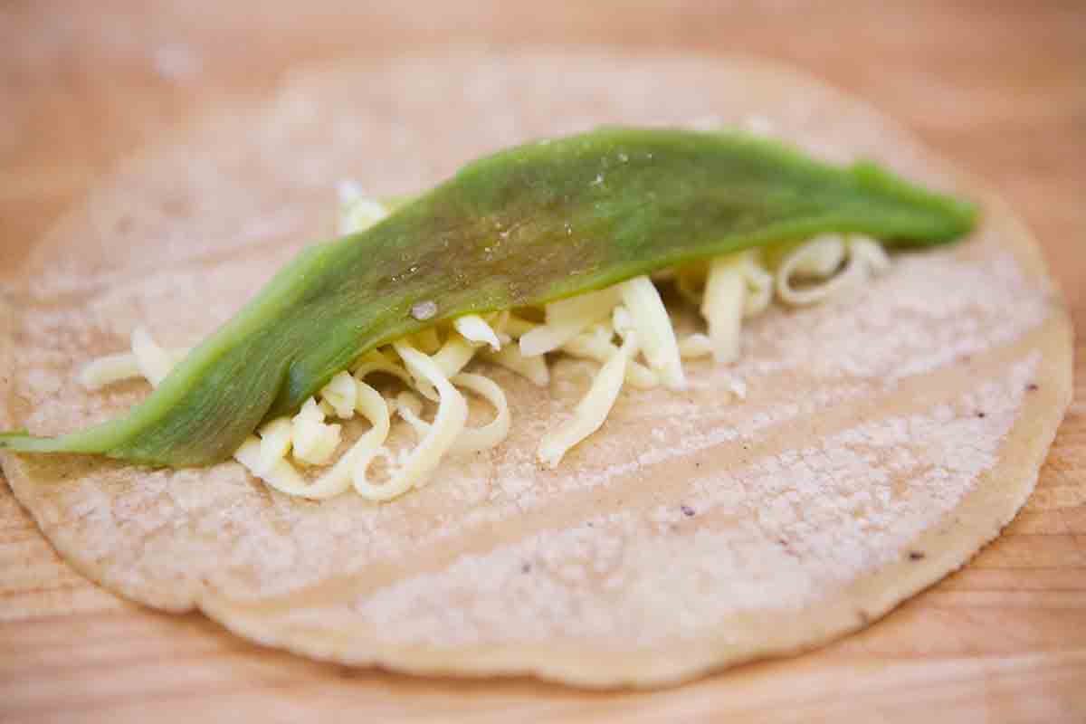 stuff tortilla with cheese and green chile