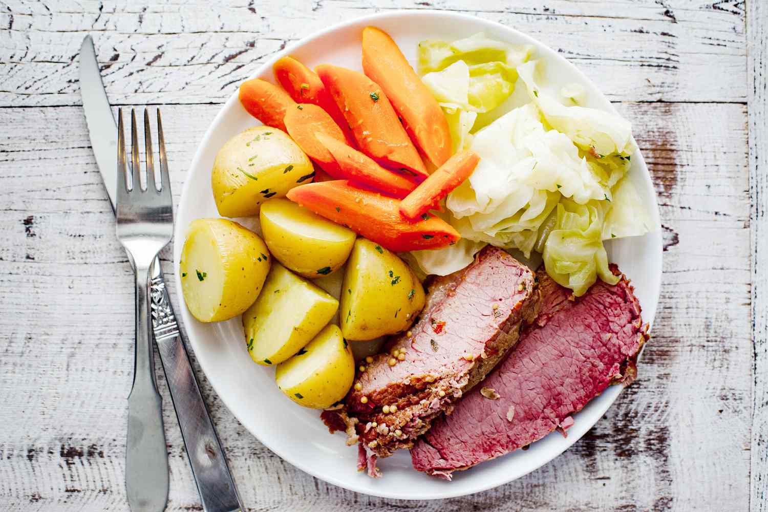 Insta Pot Corned Beef - corned beef, cabbage, potato, carrots on plate