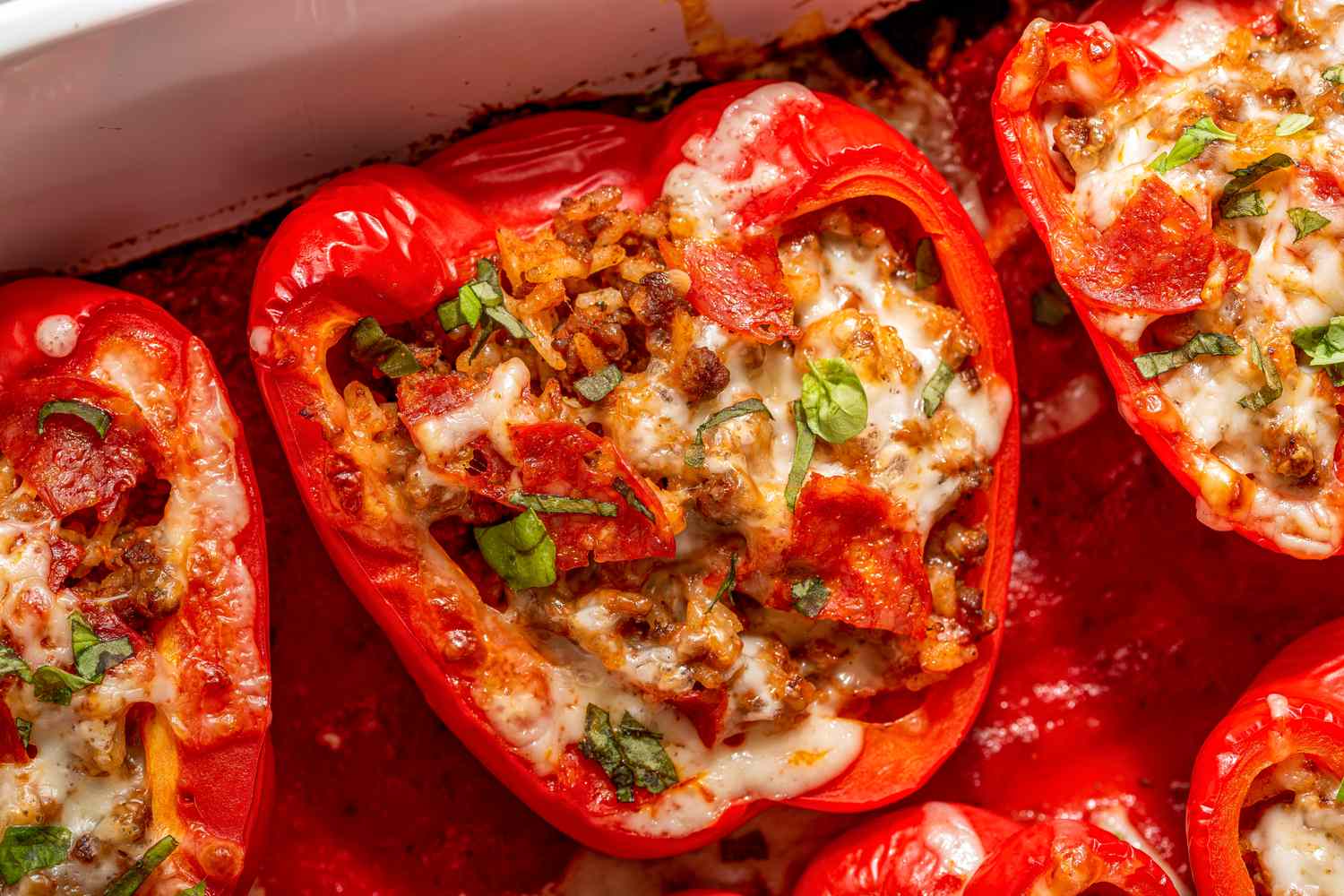 pizza stuffed peppers in a casserole dish (close-up)
