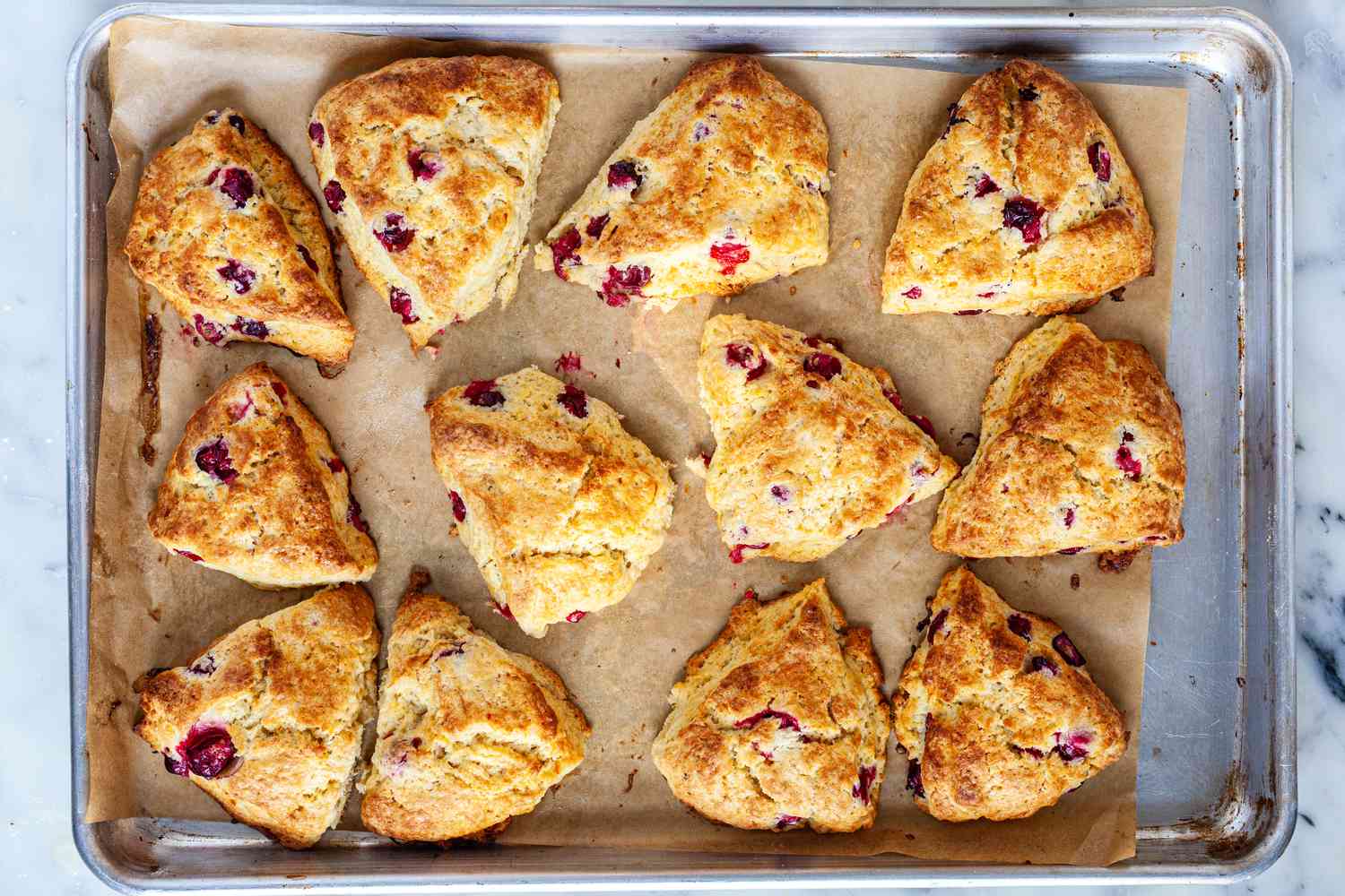 Baked scones on baking sheet.