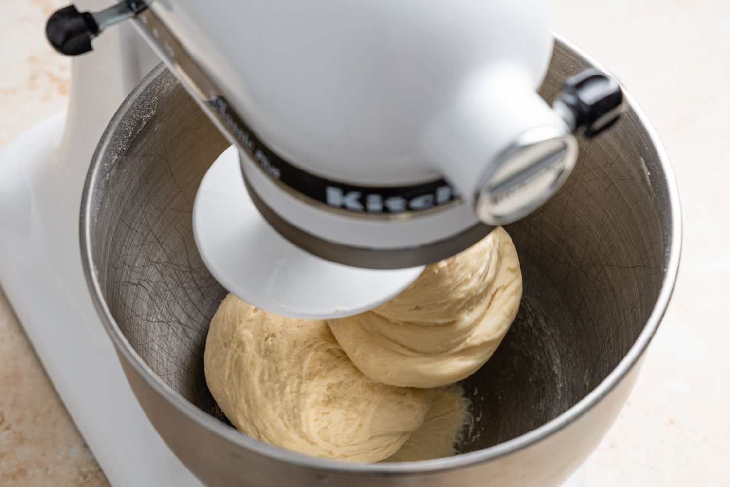 Milk Bread Roll Dough Mixed Together in Stand Mixer (Dough Formed around Dough Hook)