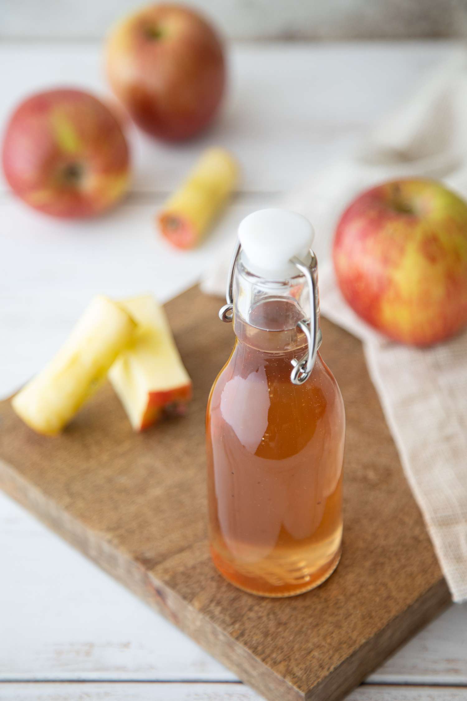Spiced apple core simple syrup in swing top bottle
