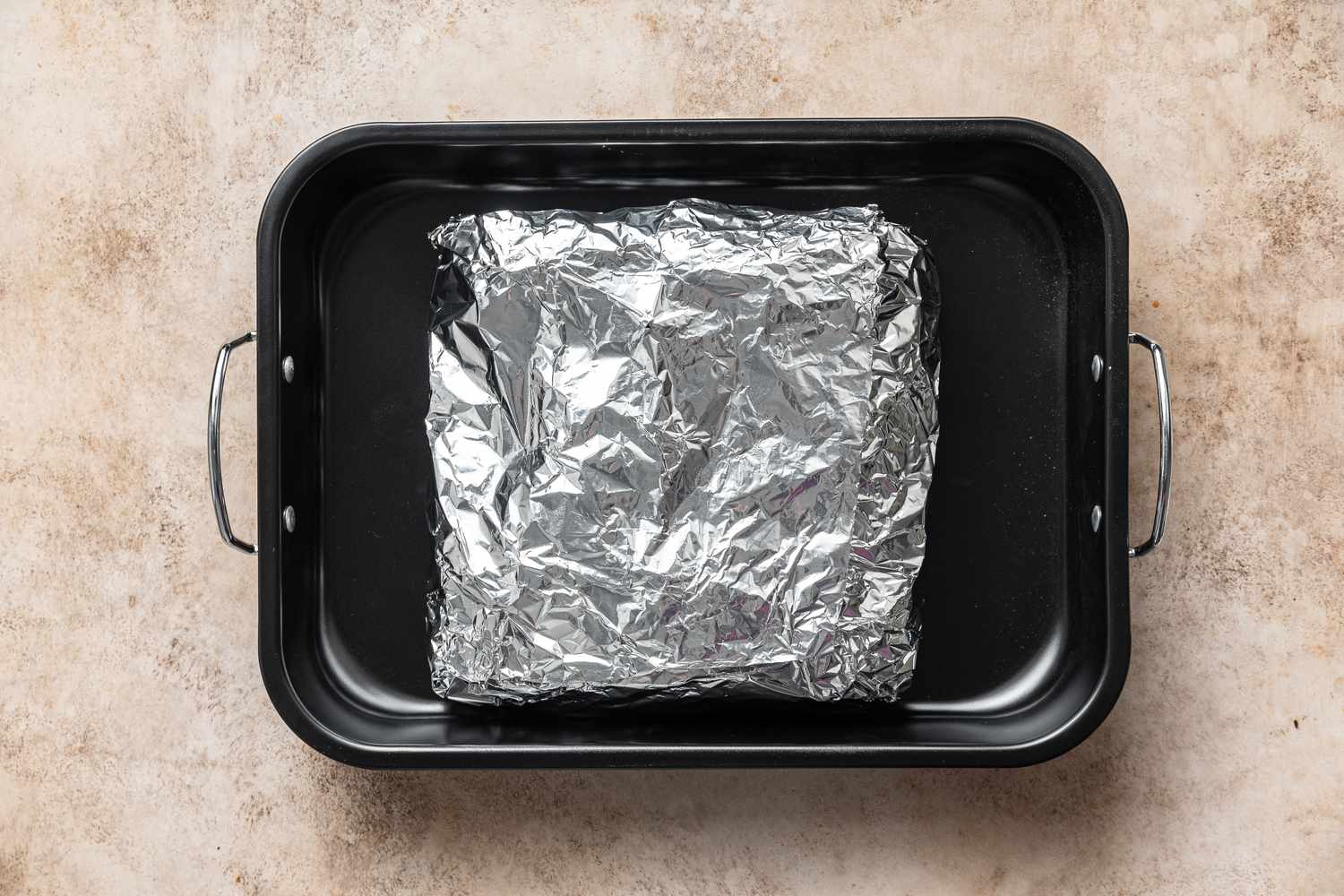 Easy Beef Brisket recipe wrapped in foil to bake in the oven