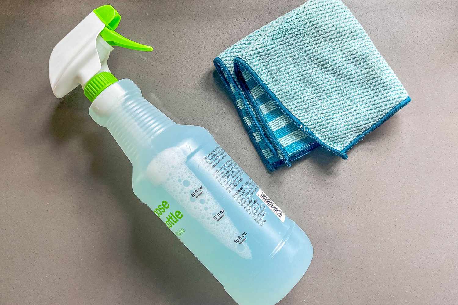 Bottle of 2-ingredient cleaning solution and a towel