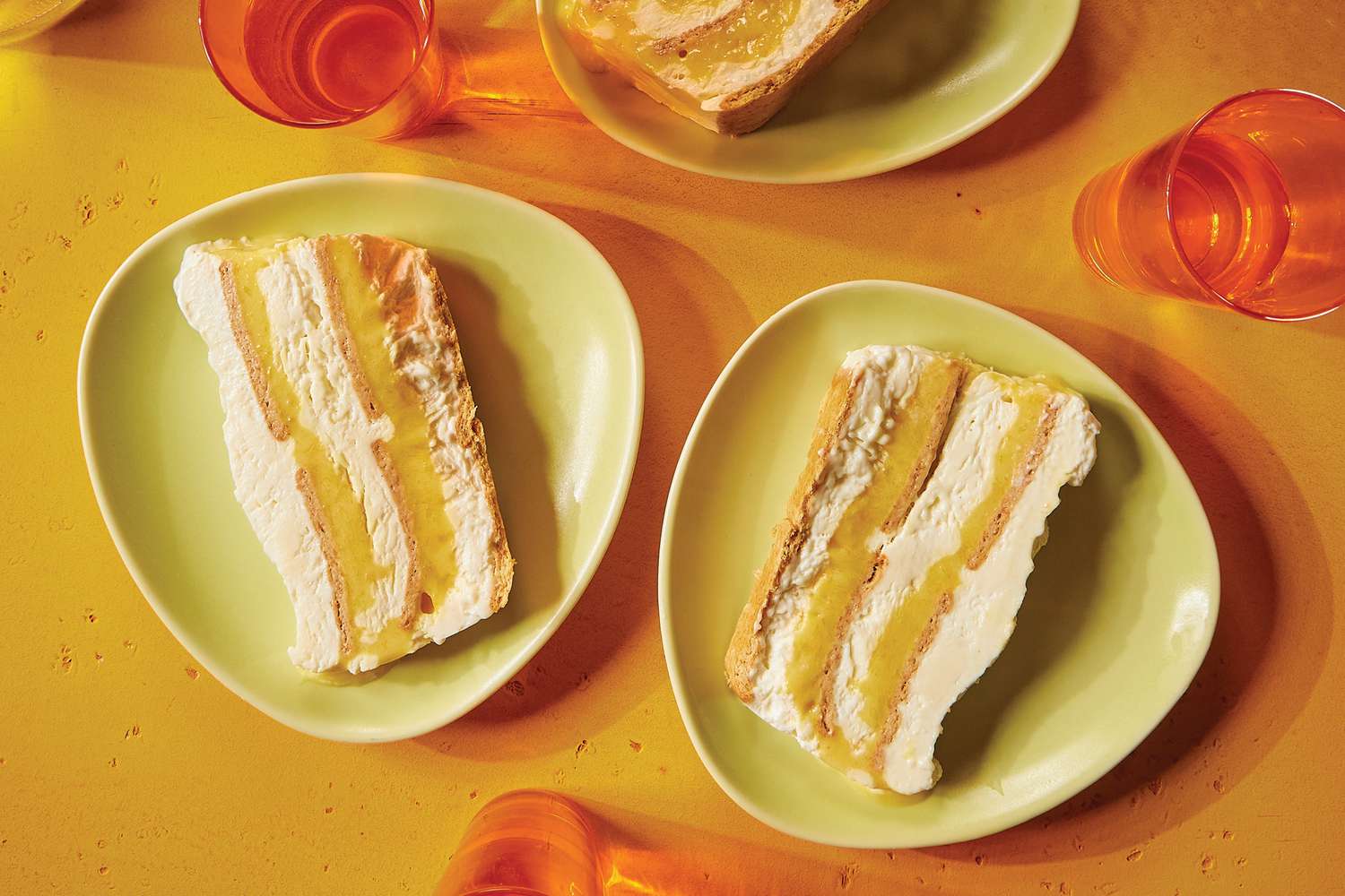 Two plates with layered dessert slices