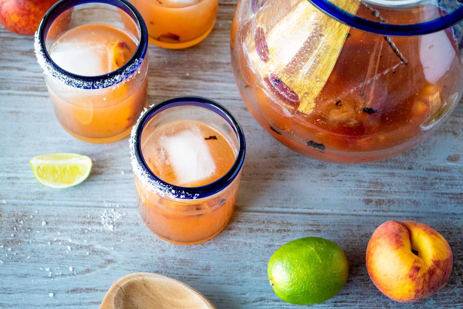 Overhead view of peach margaritas made with grilled peaches.