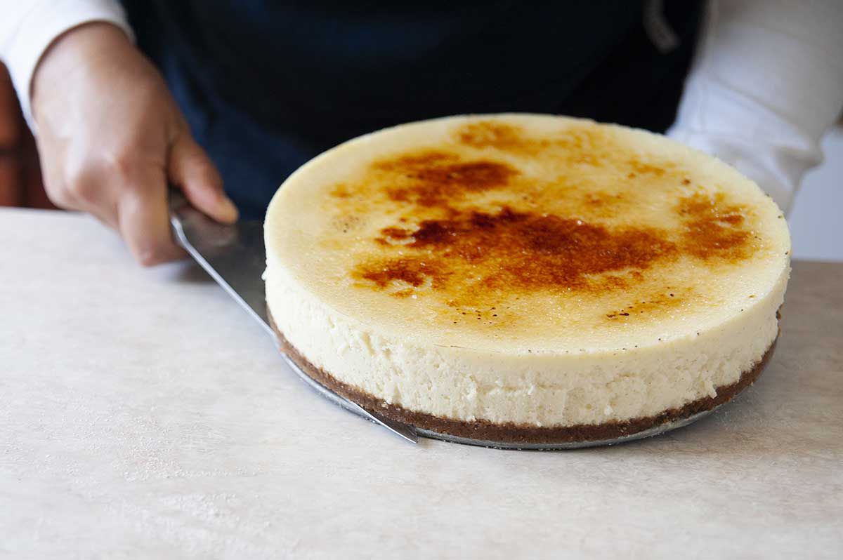 A Vanilla Bean Cheesecake with a brittle sugar creme brulee topping.