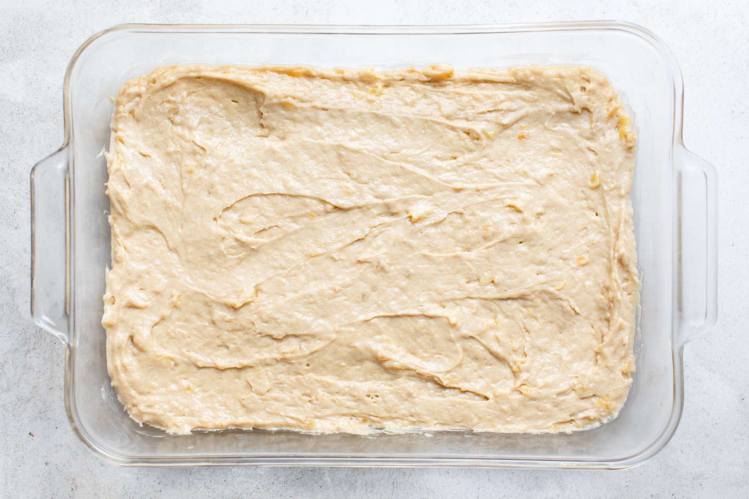 Banana Sheet Cake Batter Evenly Distributed in Pyrex Baking Dish