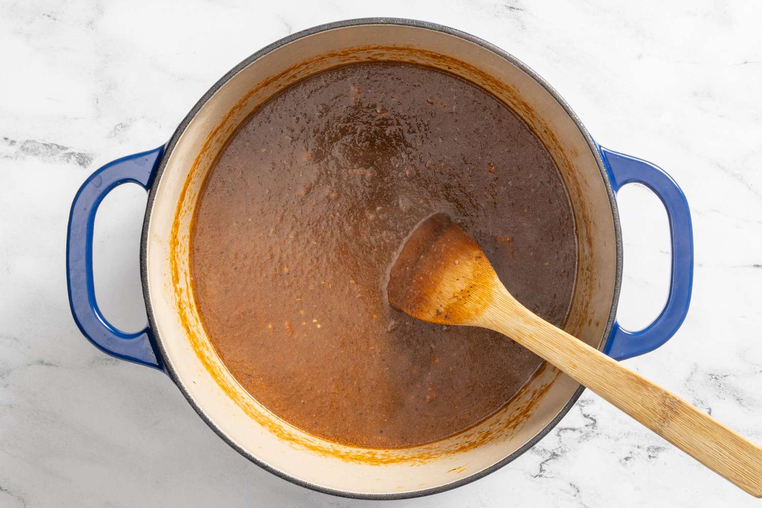 vegetable puree added to dutch oven for borracho beans (frijoles beans) recipe