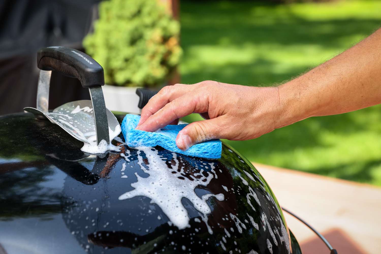 Charcoal Grill Hood Cleaned with Soap and a Sponge