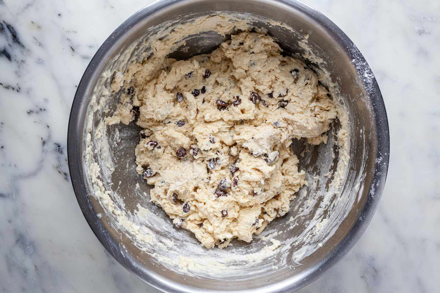 Irish Soda Bread dough with raisins in a bowl