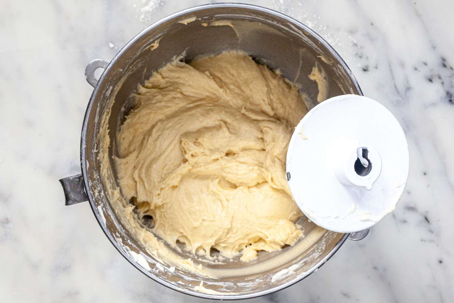 A dough hook mixing the dough for the ultimate brioche buns for hamburgers.