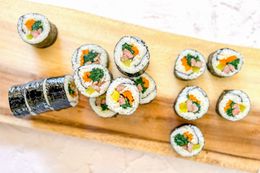 Classic Kimbap on a Wooden Plaque