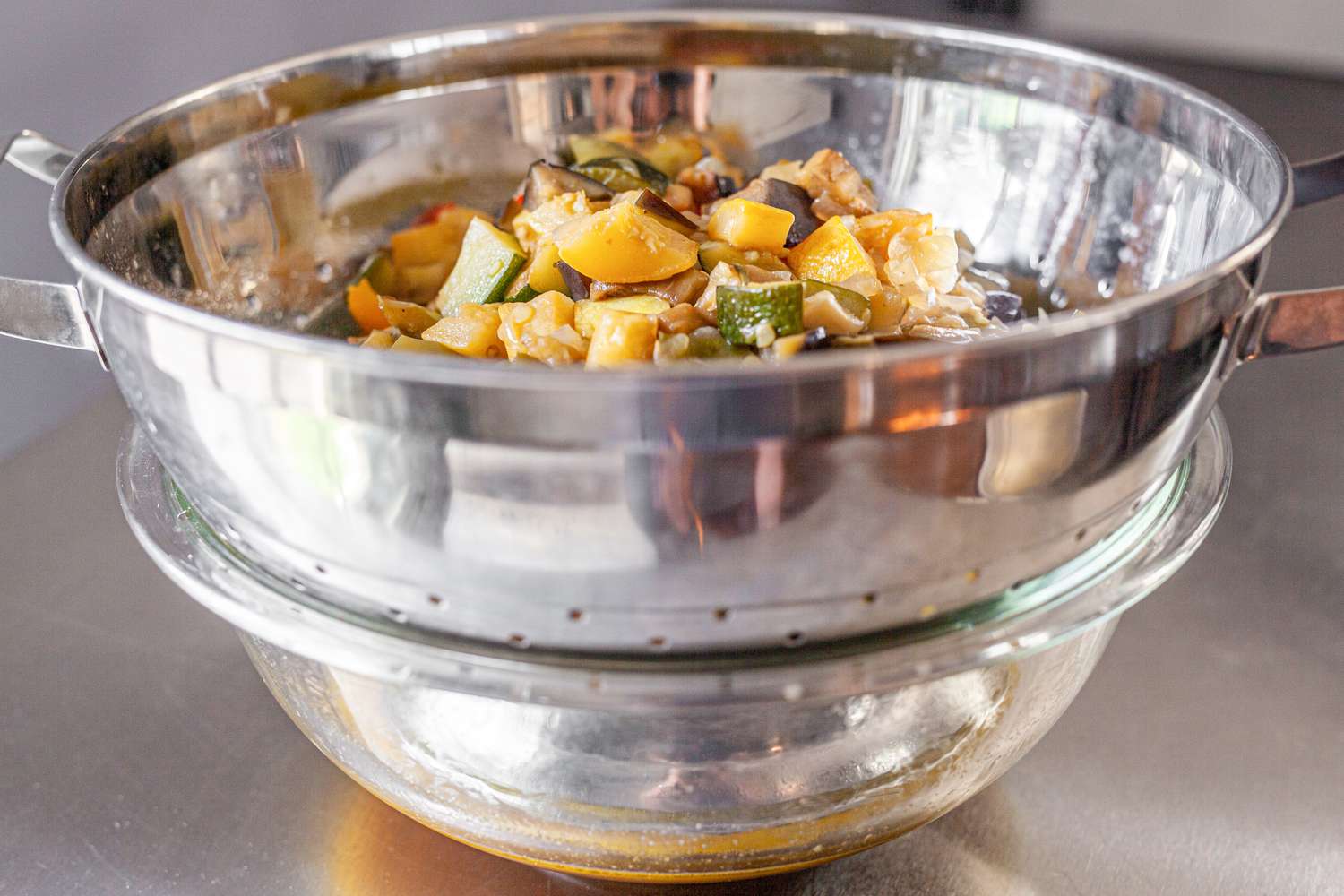 Vegetables in a Colander to Drain Vegetables Juices into a Bowl