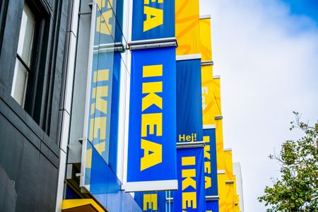 IKEA store signs mounted on a building exterior in an urban setting