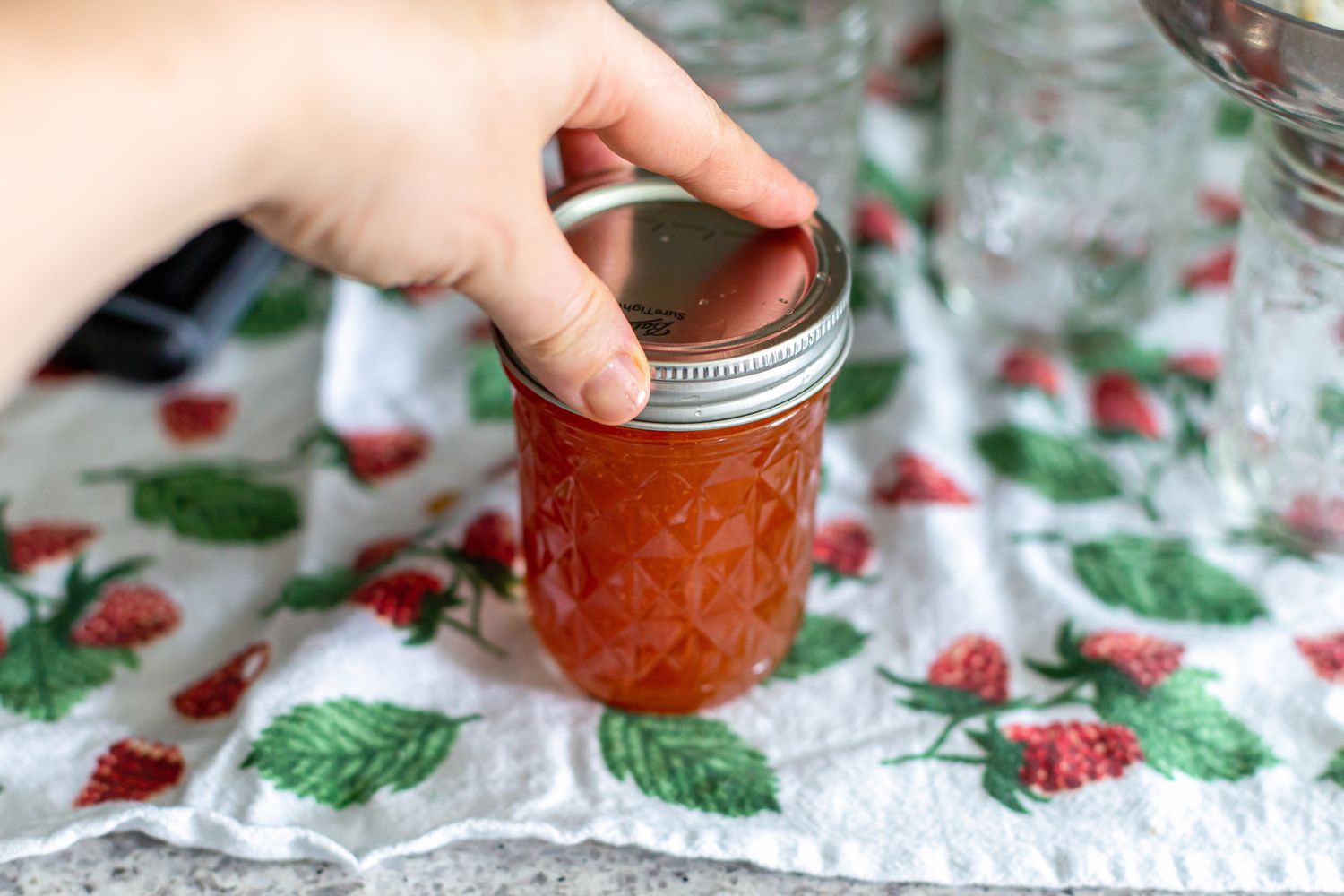 Top Screwed Shut on Peach and Pineapple Jam Jar